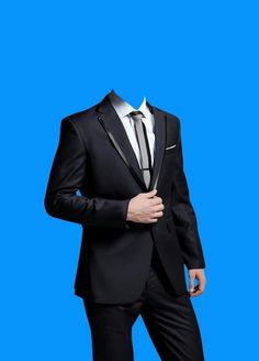 a man in a suit and tie is posing for a photo against a blue background