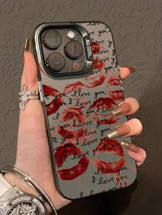 a woman's hand holding an iphone case with lipstick on it and the words love you