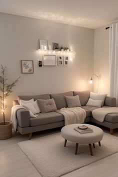 a living room with a sectional couch and coffee table in the corner, surrounded by white rugs