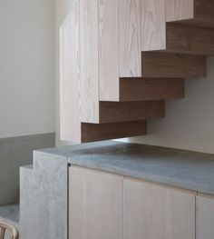 the stairs are made of wood and concrete