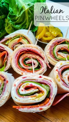 several sandwiches are stacked on top of each other with toothpicks in the middle