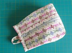 the zippered pouch is made with multicolored fabric