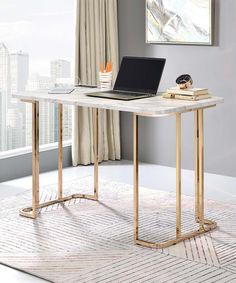 a laptop computer sitting on top of a white desk next to a book shelf and window