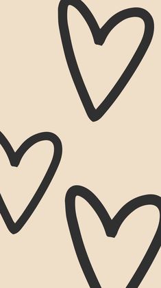 three hearts drawn in black and white on a beige background