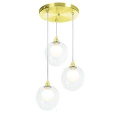 three lights are hanging from the ceiling in a modern style with glass globes and gold trim