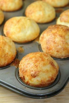 muffins are sitting on a baking tray ready to be baked in the oven