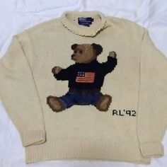 The Original Sit Down Bear From 1992 Not A Retro The Collar Is Turtleneck But Is Damaged If You Know A Good Tailor You Can Turn This Into A Crewneck The Year 1992 Was Huge For Ralph Laurens Polo Line Must Have For Any Collector ***All Used Items Are From My Personal Collection All My Items Are Kept In Storage Containers Please Keep In Mind When Purchasing. The Items May Or May Not Have That Fresh Scent. I Do Not Dry Clean Any Item Before I Ship Unless Requested. All Items Are In Great To Mint Condition Unless Stated, Nothing Has Holes, Rips, Or Stains. If Any Item Has Any Defects, I Will Make Note Of It Make An Offer***** Open To Offers Polo Bear Sweater, Sweaters Ralph Lauren, Ralph Lauren Polo Bear, American Flag Sweater, Bear Sweater, Polo Ralph Lauren Sweater, Polo Ralph Lauren Women, Bear Hoodie, Polo Bear