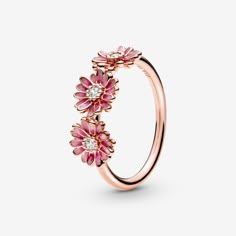 Bring flower power to your style with this flower crown-inspired Pink Daisy Flower Trio Ring. The daisy ring features a 14k rose gold-plated and is decorated with three enamel flowers with cubic zirconia in the centre. A hand-painted finish brings the vibrant petals to life with delicate shading. Inspired by the daisy, a flower which blooms in adversity and represents freedom, the ring serves as a stylish reminder to stay true to who you are. - Pandora Pink Daisy Flower Trio Ring - Enamel / 14k Rose gold-plated unique metal blend / Cubic Zirconia / Pink - Sz. 5 Pink Daisy Flower, Pandora Pink, Pandora Rose, Trio Ring, Flowers Jewelry, Daisy Ring, Bracelet Pandora, Pandora Rings, Amber Ring