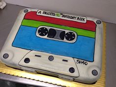 a birthday cake made to look like an old school cassette