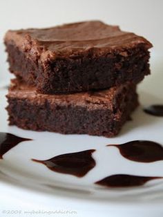 two pieces of chocolate cake on a plate