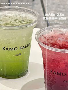 two drinks are shown on a table, one is green and the other is red