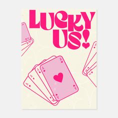 lucky us playing cards with hearts in pink and white on the front, against a beige background