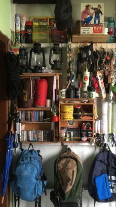 there are many backpacks and books on the shelves in this room that is filled with stuff