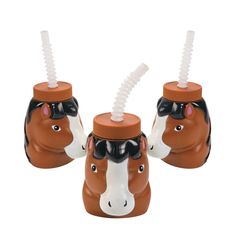 two brown and white horse shaped cups with straws in them on a white background