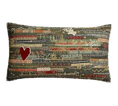 a decorative pillow with a heart on it