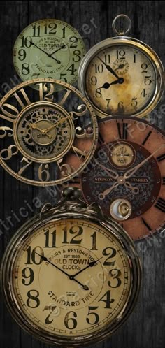 an assortment of clocks hanging on a wooden wall in different colors and sizes, with the time displayed