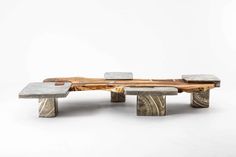 a bench made out of wood and concrete with two benches on each side that are connected to one another