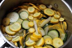 cucumbers and onions are being cooked in a pot