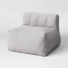 a white chair sitting on top of a white floor