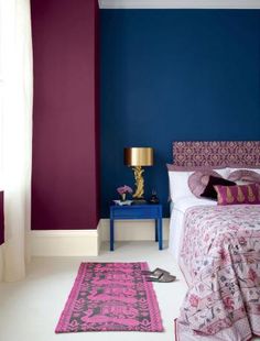 a bedroom with blue walls and purple carpet