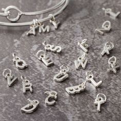 Purchase the Mini Rhodium-Colored Alphabet Capitals Charm Set by Bead Landing™ at Michaels. Create a personalized bracelet or a key chain for your friends and siblings using this mini alphabet capitals charm set by Bead Landing. Create a personalized bracelet or a key chain for your friends and siblings using this mini alphabet capitals charm set by Bead Landing. These tiny letters add cuteness to your DIY art projects. Details: Rhodium-colored 26 pieces Attached jump rings Nickel free Zinc allo Customizable Adjustable Silver Charms, Silver Letter Beads Charms For Gifts, Personalized Silver Name Bracelet With Letter Beads, Silver Charm Bracelet With Letter Beads As Gift, Silver Charm Bracelet With Letter Beads For Gift, Customizable Silver Name Bracelet With Round Beads, Silver Letter Beads Jewelry For Personalized Gift, Personalized Silver Jewelry With Letter Beads, Alphabet Charms