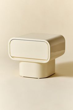 a white square object sitting on top of a table