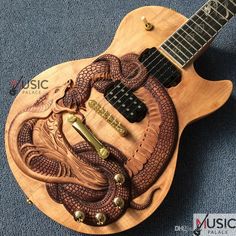 an electric guitar with a snake on it