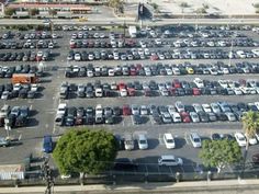 an aerial view of a parking lot full of cars