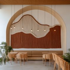 the interior of a restaurant with wooden tables and wicker chairs hanging from the ceiling