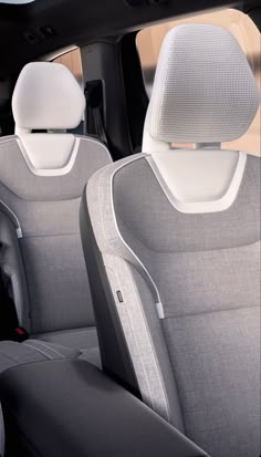 the interior of a car with two rows of seats