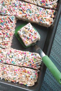 a pan filled with rice krispy kreme bars and sprinkles