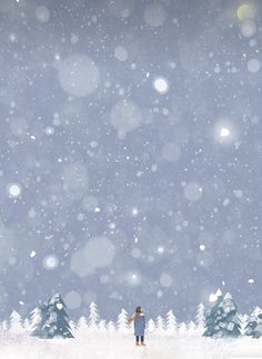 a person standing in the snow looking up at some trees with snow flakes on them