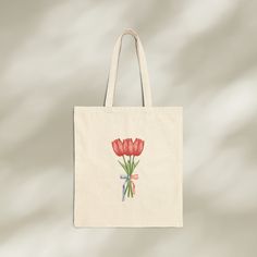 This handcrafted tulip bouquet canvas tote bag is perfect for every occasion. From days at the beach, to afternoons at the park, this shoulder bag can bring some american summer vibes to your everyday life.  Elite Quality: This 100% cotton tote bag comes made from durable, eco-friendly materials. All ink used for the designs is water-based, biodegradable, and non-toxic. These double stitched seams and sturdy handles help ensure that this tote bag is ready for the tasks of everyday life.  ✨Versat Tote Bag Christian, Christian Tote Bags, American Summer, Canvas Flats, Bag Flower, Tulip Bouquet, Tulip Design, Cotton Tote Bag, Tote Bag Design