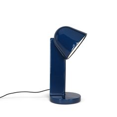 a blue desk lamp with a white background