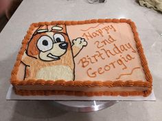 a birthday cake with an image of a dog on it