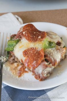 a slice of pizza on a plate with a fork