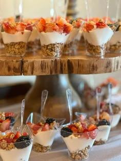 an assortment of desserts are displayed on a table