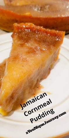 a piece of food on a plate with the words jamaican cornmeal pudding below it