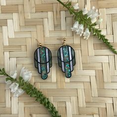 "These acrylic earrings are made to look like Art Deco stained glass. I have many color variations available, and in pendants as well, check out the shop for all my variations. These elegant earrings are in Teal Flake and Matte Black. The  \"panes\" are in metallic teal flake, mint glitter pearl, and sea glass.  The panes are translucent giving them an ethereal and stained glass feel. The \"frame\" is in matte black.  Studs pictured are gold finished stainless steel. I know some people prefer studs and some prefer ear wire, so you have the option of selecting your earring closure. The last picture shows an example of your choices. All earrings are hand assembled and designed by me. These are made of laser cut acrylic. The acrylic is thin and lightweight, resulting in a bold look without be Art Deco Dangle Brass Earrings, Iridescent Acrylic Earrings, Artsy Enamel Drop Earrings, Blue Artsy Resin Earrings, Blue Hypoallergenic Glass Earrings, Art Deco Stained Glass, Deco Beads, Laser Cut Jewelry, The Last Picture Show