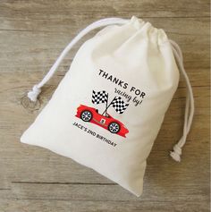 a drawstring bag that says thanks for racing day with a race car on it