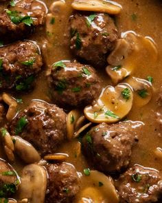 meatballs with mushrooms and gravy in a skillet, ready to be eaten