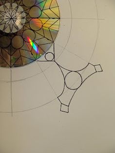 an image of a cd being drawn on a piece of paper