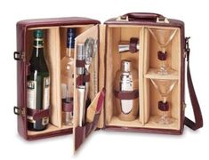 an open leather case with bottles and glasses in it