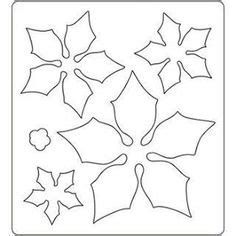 a paper cutout with holly leaves and snowflakes in the center, on a white background