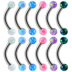 six different colored balls are attached to the metal barbells with black and white opals