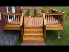 a wooden deck with railings and steps