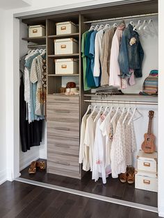 an open closet with clothes and other items