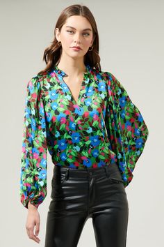 Add a pop of a colorful touch to your outfit of the day with the Destine Floral Hathaway Split Neck Long Sleeve Blouse! It features a ruffle split neckline framed by billowing balloon sleeves. The bodice maintains a relaxed fit and can be styled tucked into your favorite high waisted pants. This top is perfect for anything from day parties to dinner with friends.- Split neckline- Elastic cuffs - Lined- Balloon sleeves- Color: Green blue fuchsiaSize + Fit - Model is 5'8" and wearing size XS- Meas Bag Patches, Dinner With Friends, Balloon Sleeves, High Waisted Pants, Outfit Of The Day, Bodice, Fitness Models, Sleeve Blouse, Split