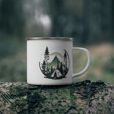 a camp mug sitting on top of a tree stump