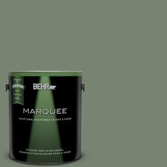 behr marquee interior paint in yellow and black, with the words marquee on it